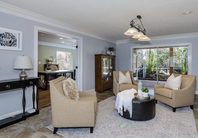 living room with ornamental molding and a wealth of natural light