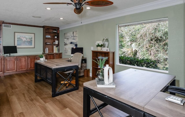 office with ceiling fan, ornamental molding, and hardwood / wood-style floors