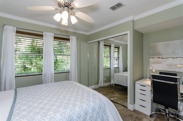 bedroom with ornamental molding, a closet, and ceiling fan