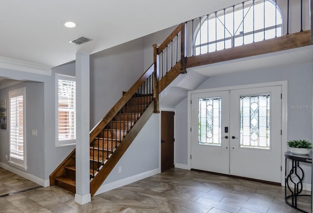 entryway with french doors and ornamental molding