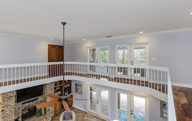 living room featuring ornamental molding, french doors, and a high ceiling