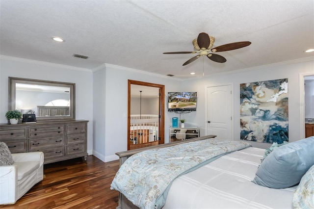 bedroom featuring dark hardwood / wood-style flooring, ceiling fan, ornamental molding, and a textured ceiling