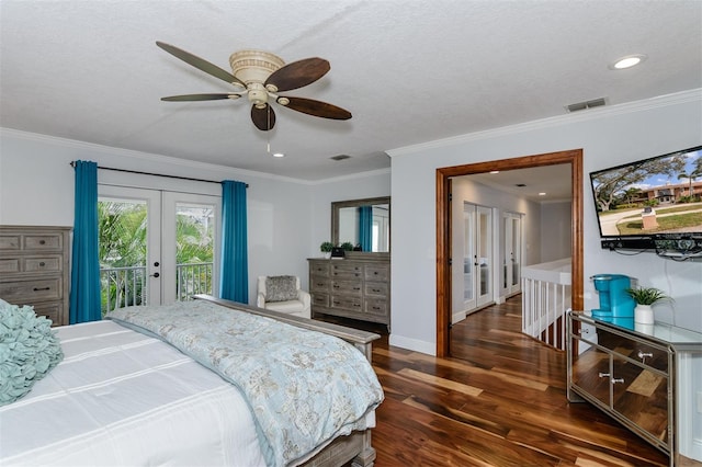 bedroom featuring crown molding, dark wood-type flooring, a textured ceiling, access to outside, and french doors