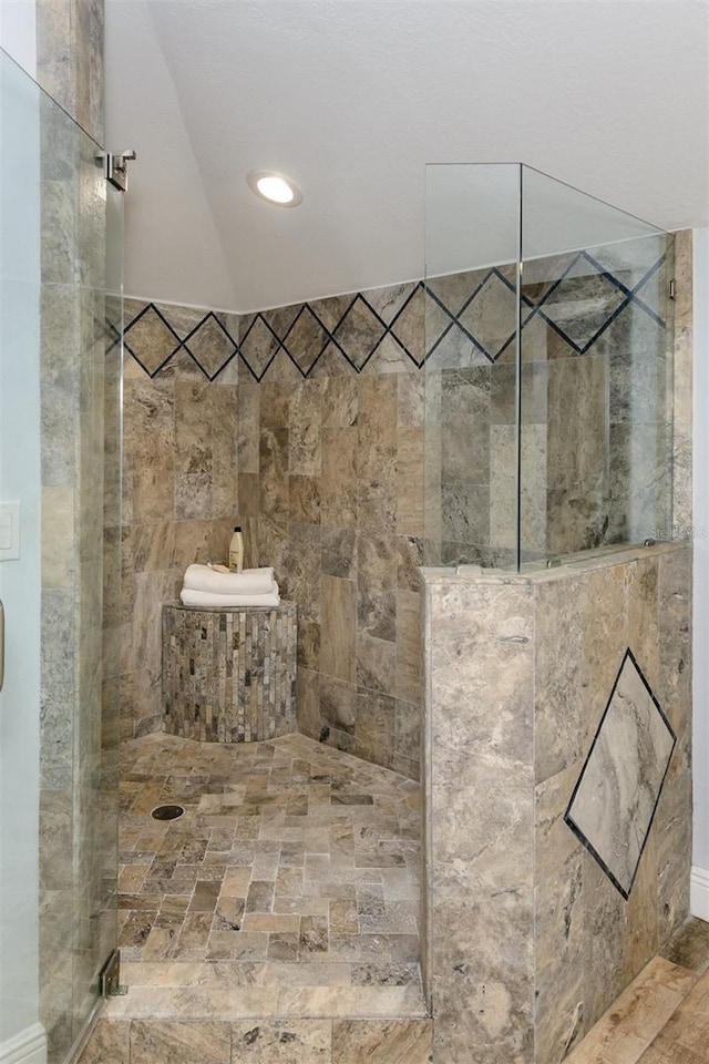 bathroom with tiled shower