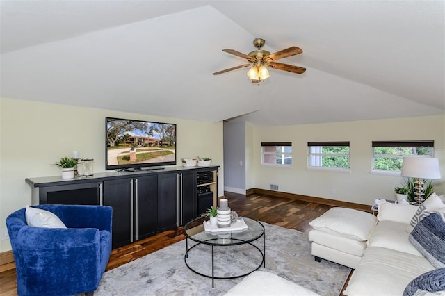 living room featuring lofted ceiling, hardwood / wood-style flooring, and ceiling fan