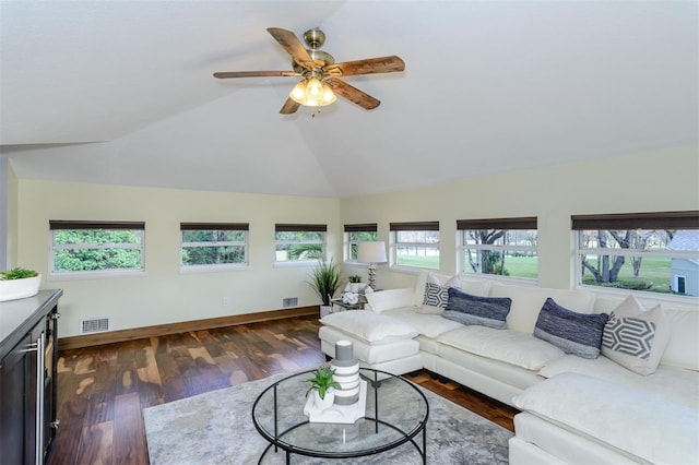 living room with lofted ceiling, dark hardwood / wood-style floors, and ceiling fan