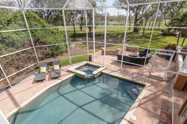 view of pool featuring an in ground hot tub, a lanai, a yard, and a patio