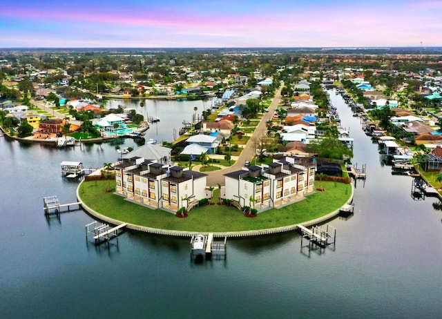 aerial view at dusk with a water view