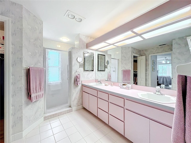 bathroom featuring tile patterned flooring, vanity, ceiling fan, and a shower with shower door