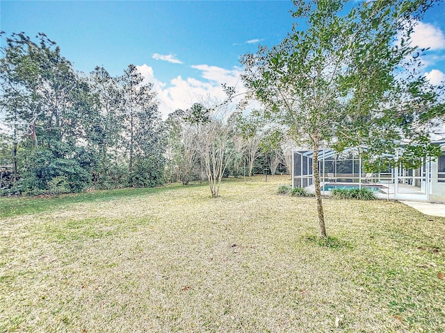 view of yard featuring a lanai