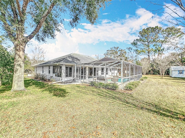 back of property featuring a lawn, a patio, and glass enclosure