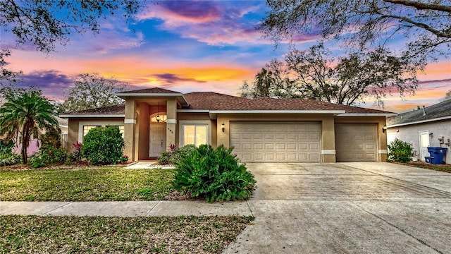 prairie-style home featuring a garage