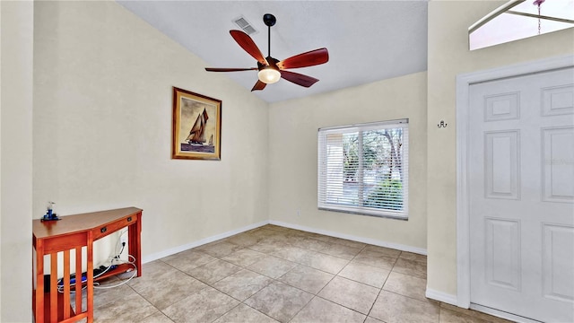 tiled entryway with ceiling fan