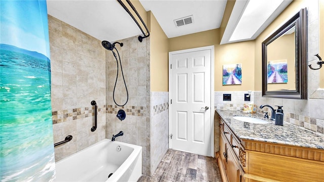 bathroom featuring vanity, wood-type flooring, tile walls, and shower / tub combo with curtain