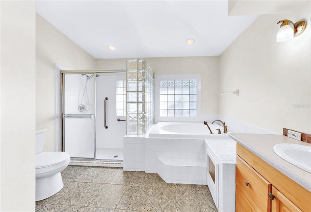 full bathroom with independent shower and bath, vanity, tile patterned floors, and toilet