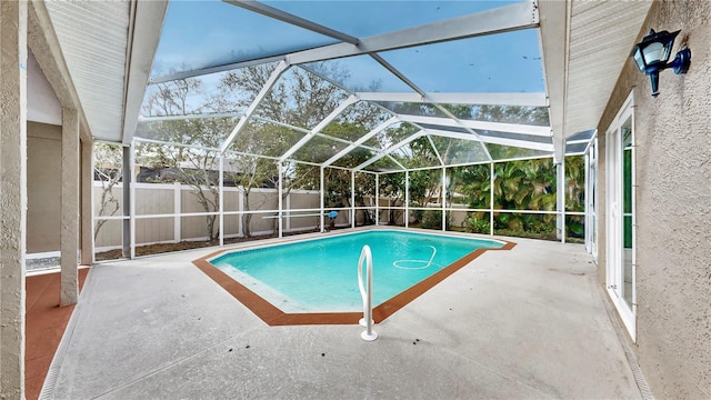 view of pool featuring a lanai and a patio