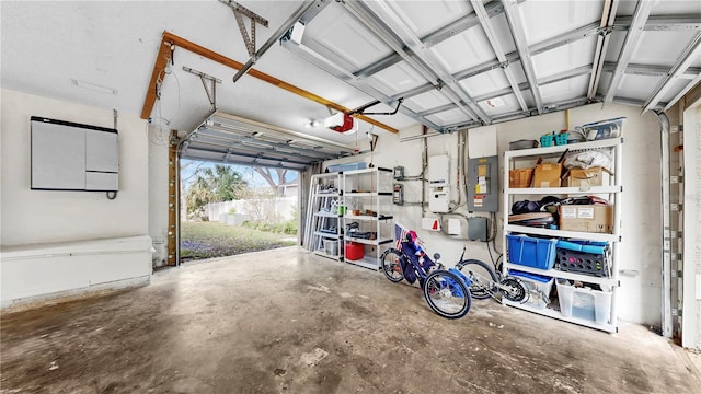 garage featuring a garage door opener and electric panel