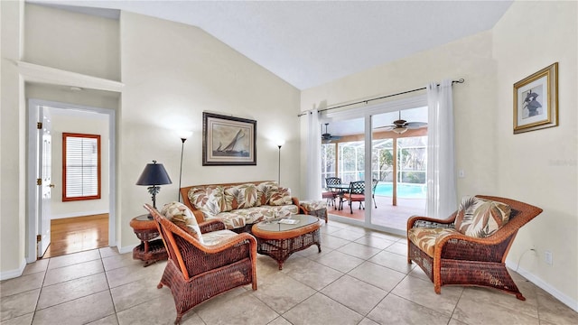 tiled living room featuring high vaulted ceiling