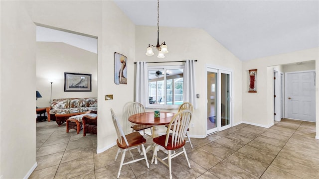 dining area with vaulted ceiling, tile patterned floors, and a chandelier