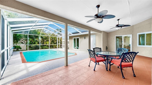 view of swimming pool with a lanai, a patio, and ceiling fan