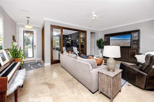 living room featuring light tile patterned floors, ornamental molding, and ceiling fan