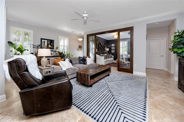 living room featuring ornamental molding and ceiling fan