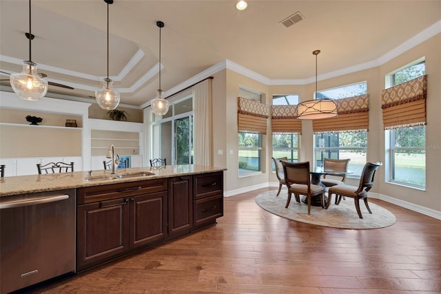 kitchen featuring sink, crown molding, dishwasher, and hardwood / wood-style flooring