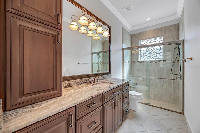 bathroom with ornamental molding, vanity, an enclosed shower, toilet, and tile patterned floors