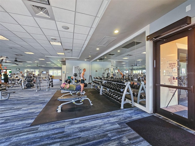 workout area with a paneled ceiling