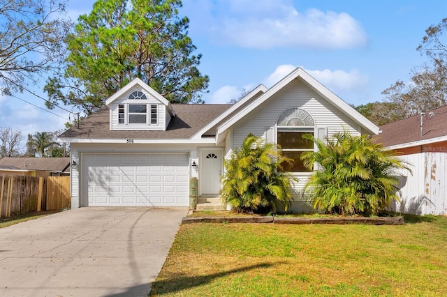 view of front of home with a garage and a front yard