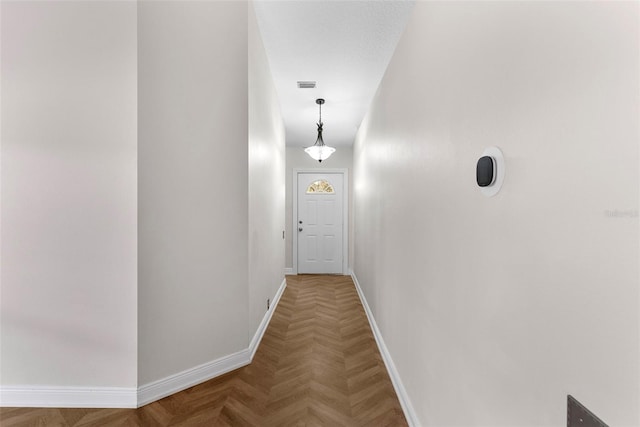 corridor featuring parquet flooring