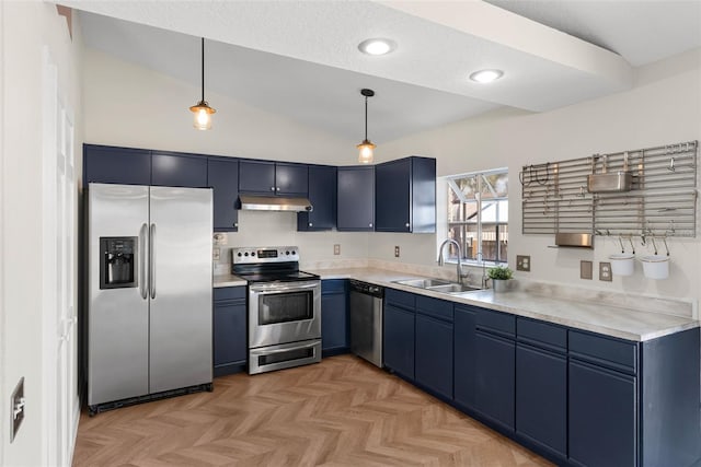 kitchen with blue cabinets, appliances with stainless steel finishes, light parquet floors, and pendant lighting