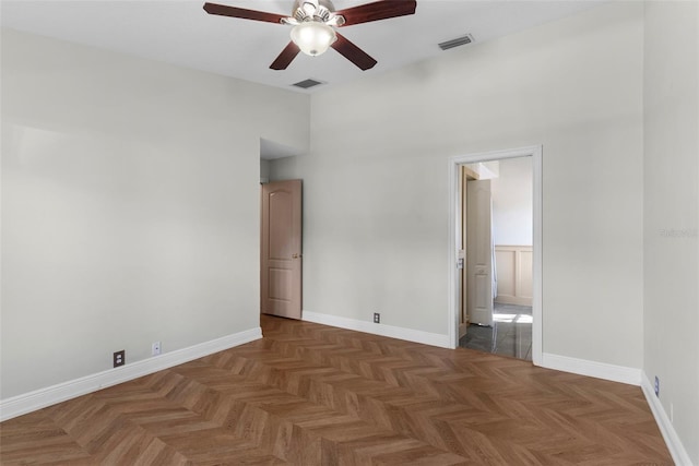 interior space with dark parquet flooring and connected bathroom