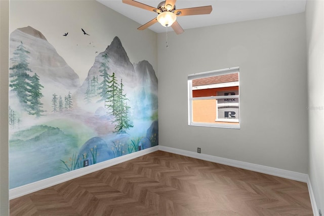 spare room featuring parquet flooring and ceiling fan