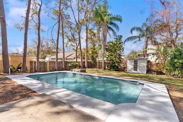 view of pool with a storage shed