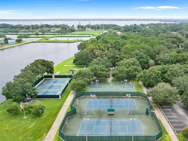 birds eye view of property with a water view