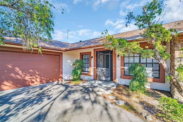 ranch-style house featuring a garage