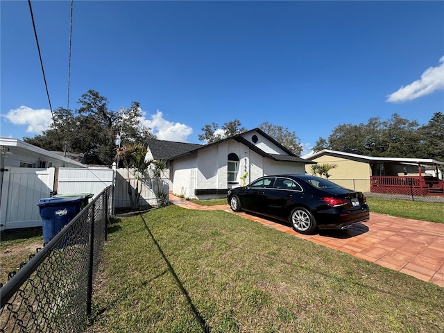 view of property exterior with a yard