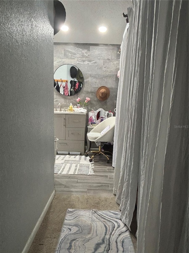 bathroom featuring sink and a textured ceiling