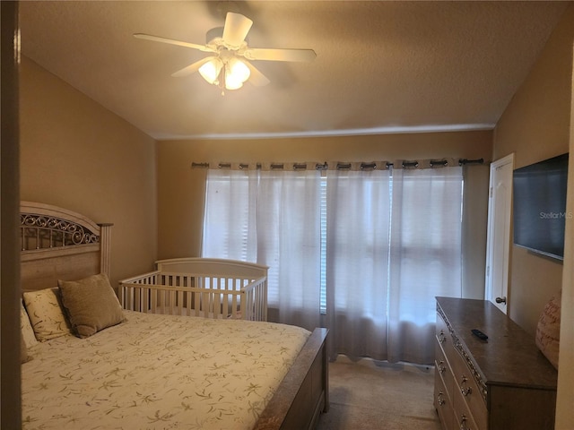 bedroom featuring carpet flooring and a ceiling fan