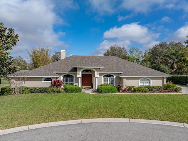 single story home with a front yard