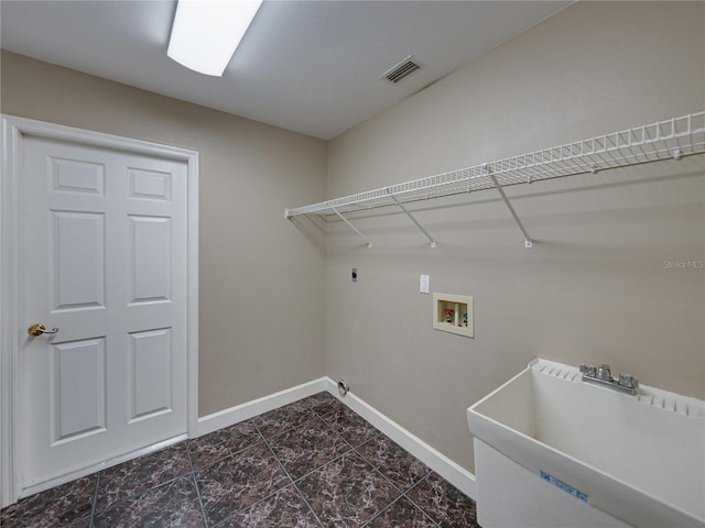 washroom featuring washer hookup, sink, and hookup for an electric dryer