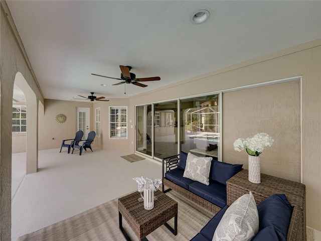 view of patio / terrace with an outdoor living space and ceiling fan