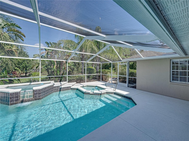 view of pool with an in ground hot tub, a lanai, and a patio