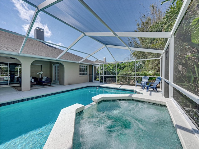 view of swimming pool featuring an outdoor hangout area, a patio, and glass enclosure