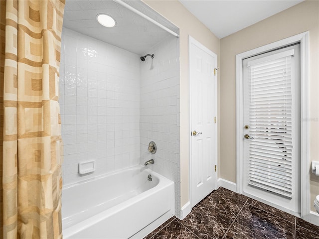 bathroom featuring shower / bathtub combination with curtain