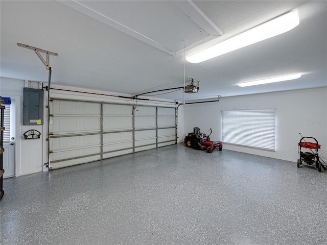 garage featuring a garage door opener and electric panel