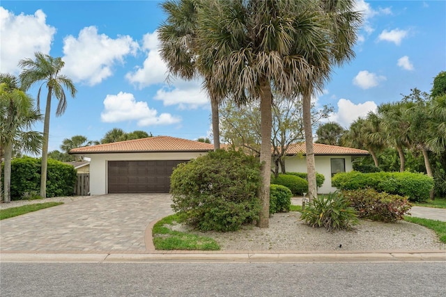 mediterranean / spanish-style house featuring a garage