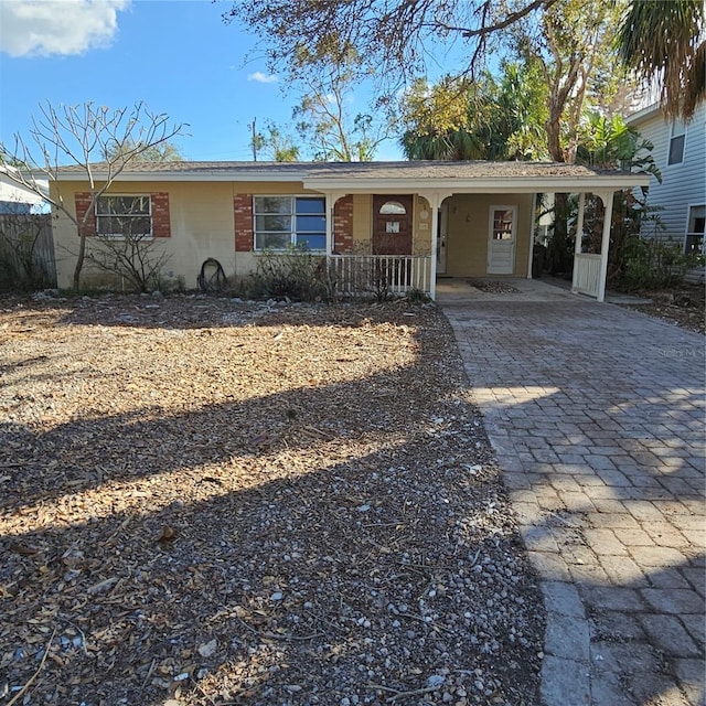 single story home with a carport