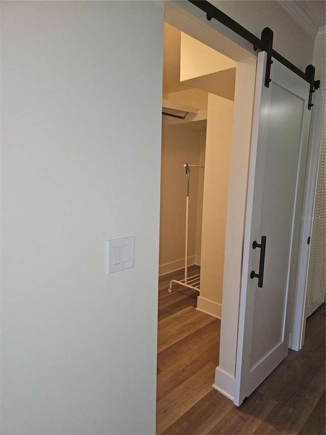 interior space with wood finished floors and baseboards